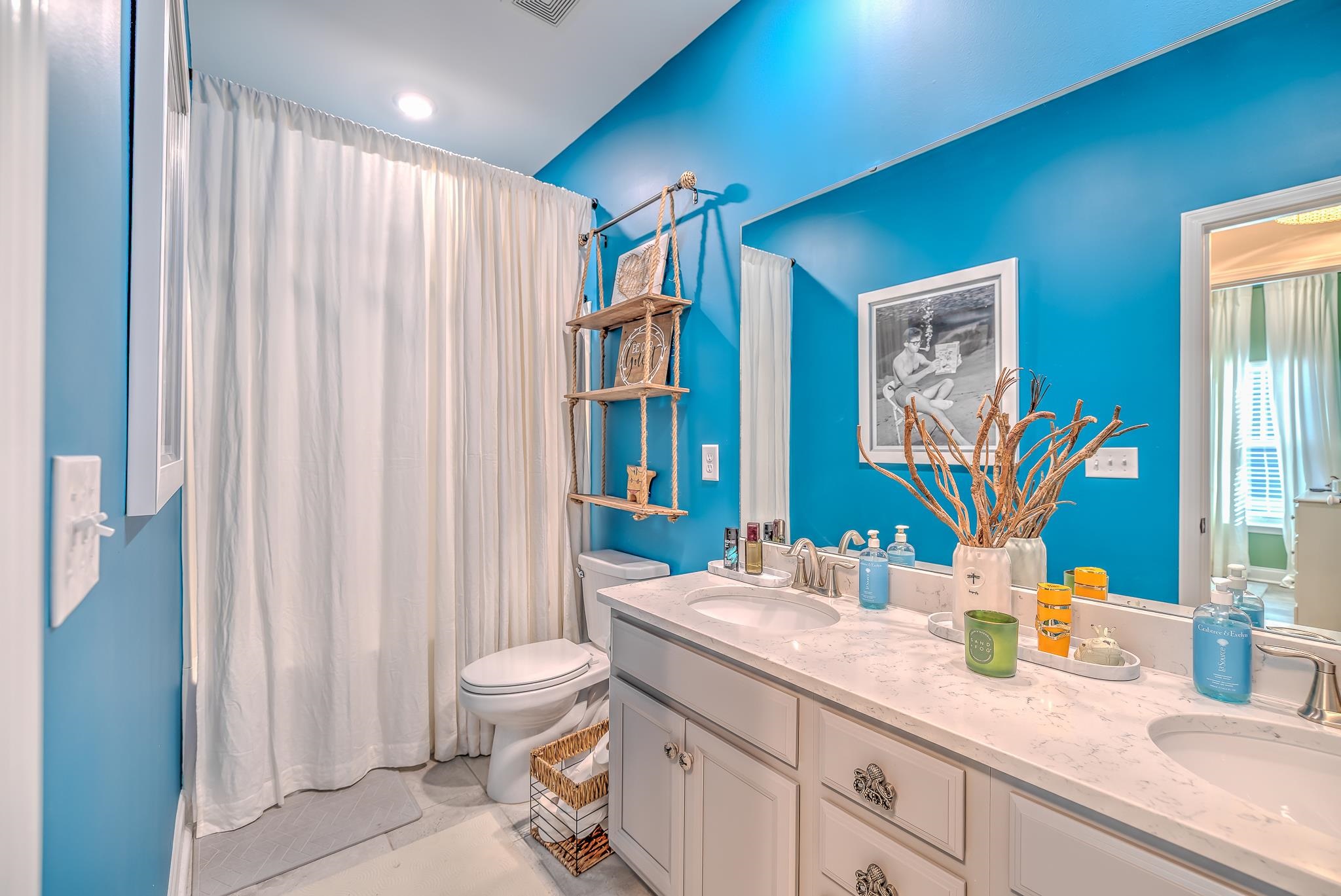 2488 Goldfinch Drive Myrtle Beach, SC 29577 - Photo 25 of 38 Full bathroom with double vanity and shower / bath combo with shower curtain