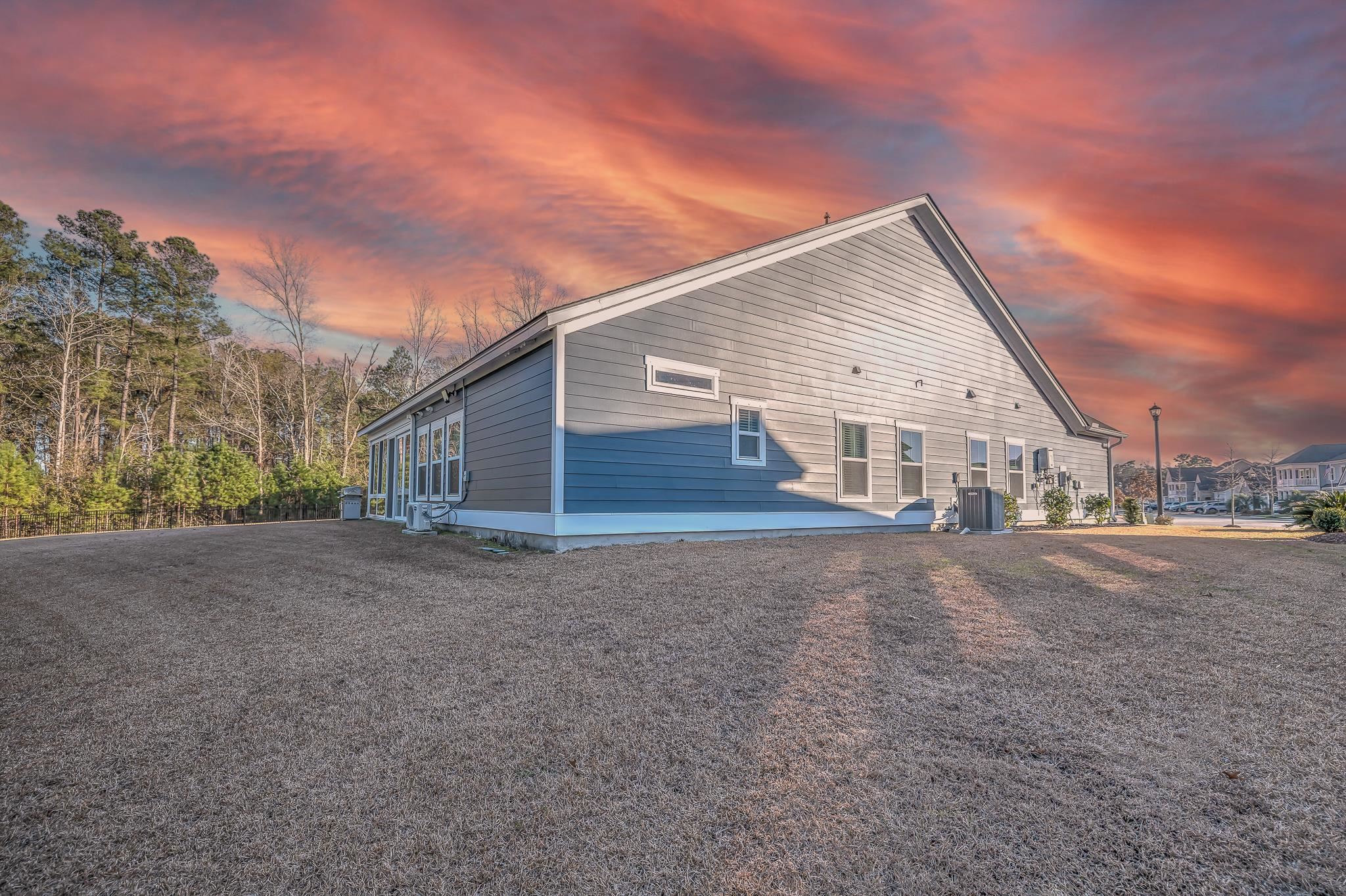 2488 Goldfinch Drive Myrtle Beach, SC 29577 - Photo 32 of 38 Property exterior at dusk featuring a central AC unit