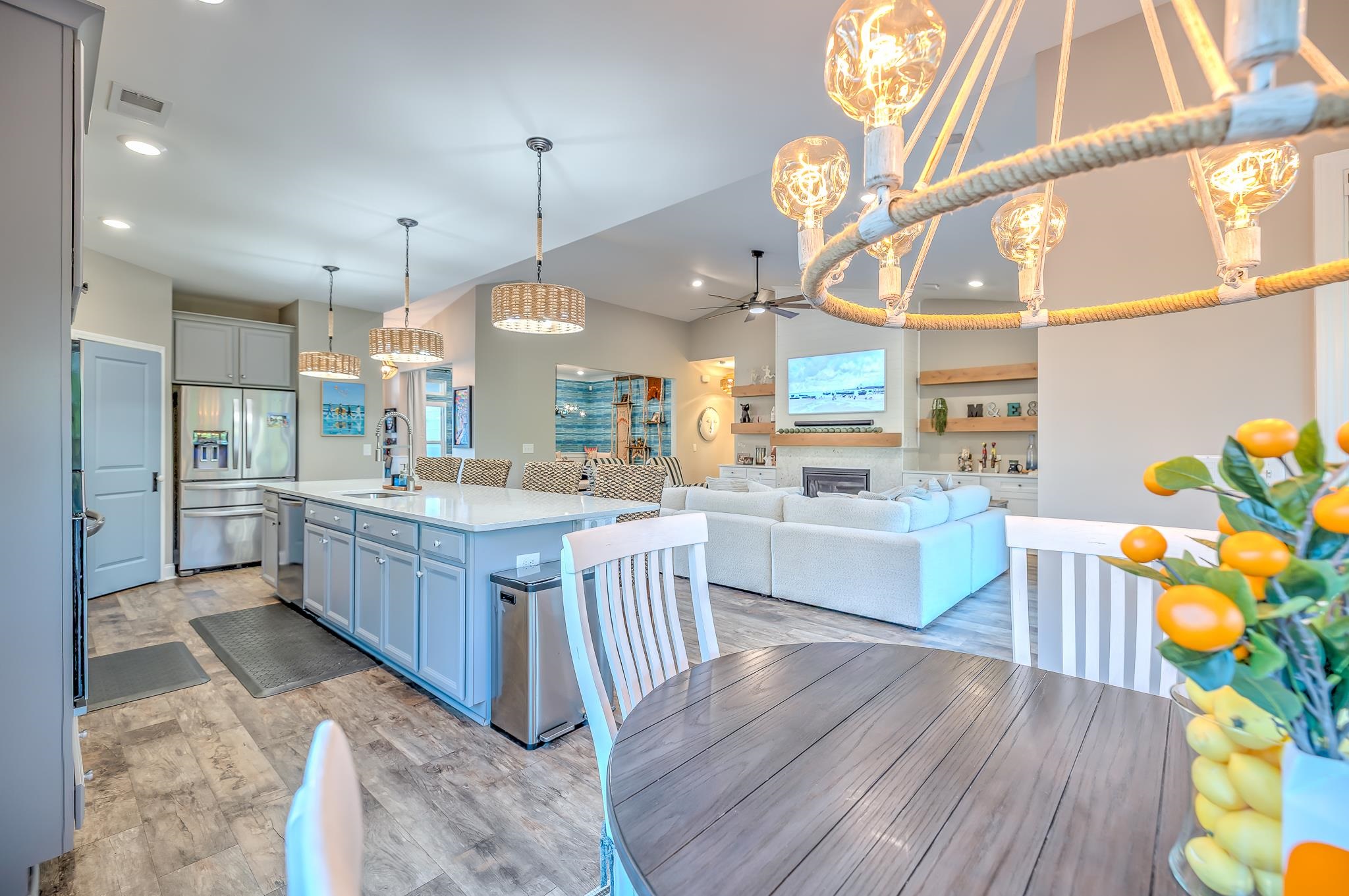 2488 Goldfinch Drive Myrtle Beach, SC 29577 - Photo 7 of 38 Kitchen with hanging light fixtures, ceiling fan, stainless steel appliances, recessed lighting, and light stone counters