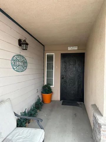 a view of a door and chair in a room