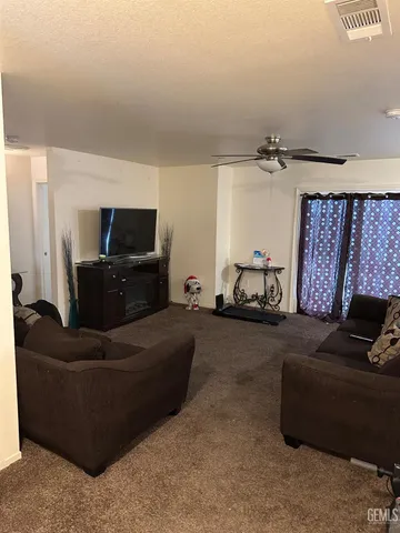 a room with furniture and a potted plant