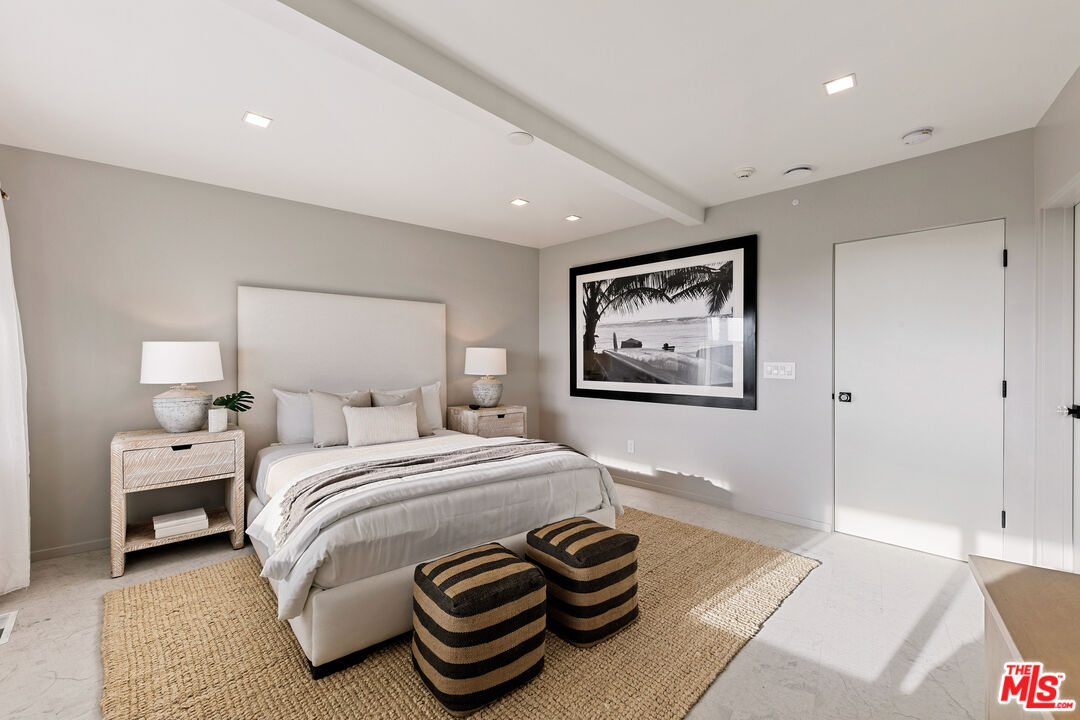 31558 Victoria Point Road Malibu, CA 90265 - Photo 44 of 55 a bedroom with a bed and a painting on the wall