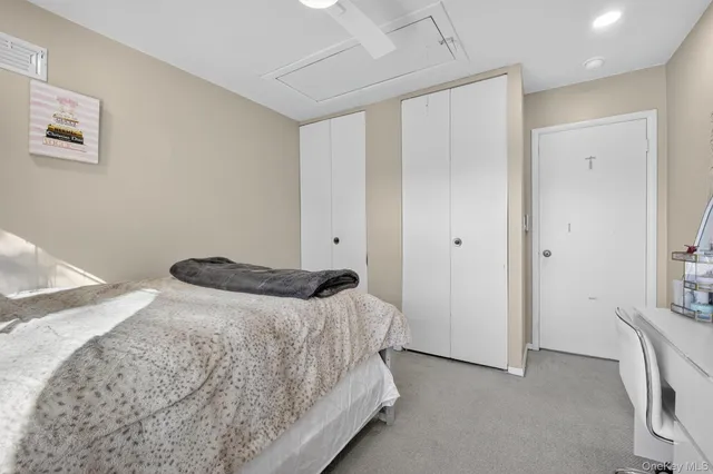 a bedroom with a bed and a view of bedroom