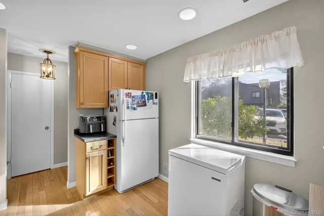 a kitchen with stainless steel appliances a refrigerator sink and cabinets