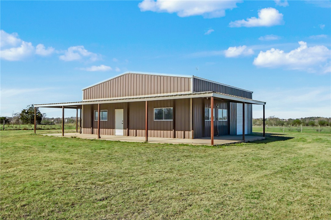 5984 Dick Elliott Road Bryan, TX 77808 - Photo 2 of 10 a view of a house with a yard