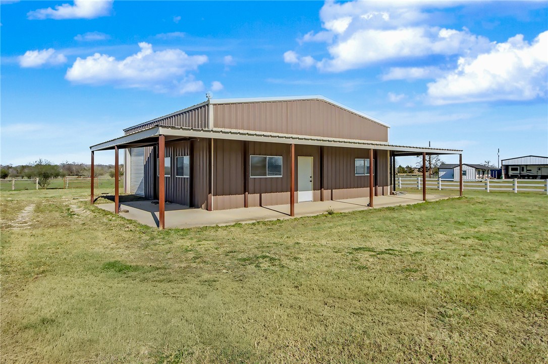 5984 Dick Elliott Road Bryan, TX 77808 - Photo 3 of 10 a view of a house with backyard porch and garden