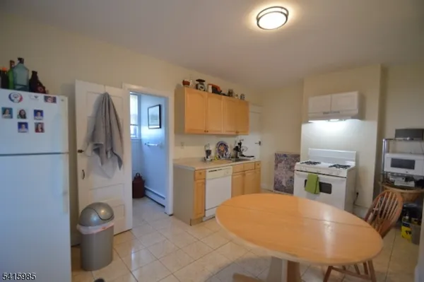 a kitchen with a refrigerator sink and stove