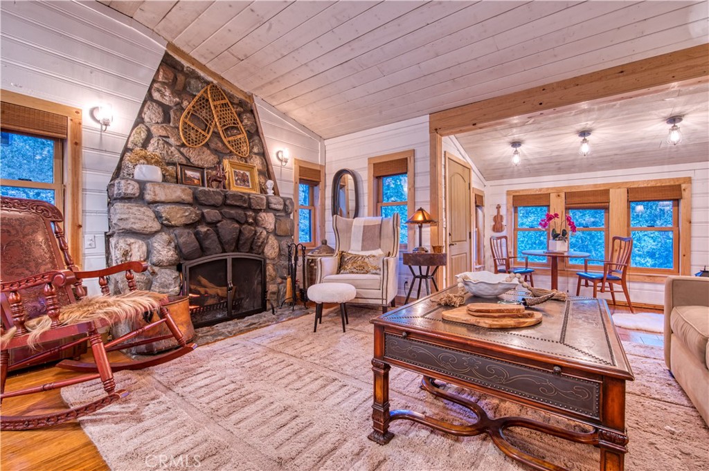 9287 Corral Road Forest Falls, CA 92339 - Photo 11 of 26 a living room with furniture and a fireplace