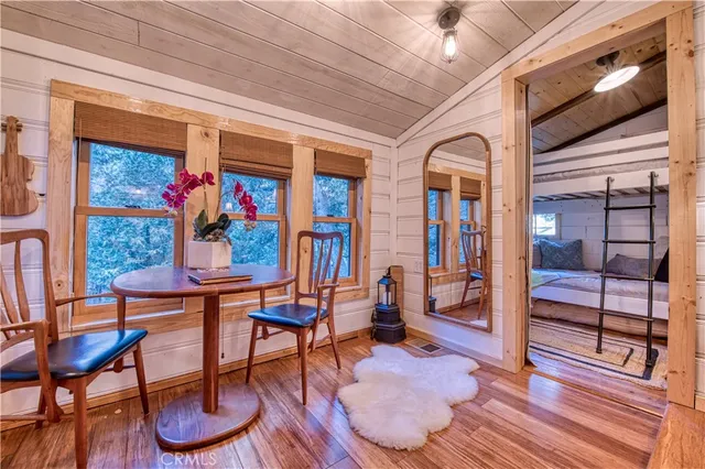a bedroom with a bed a chandelier and closet
