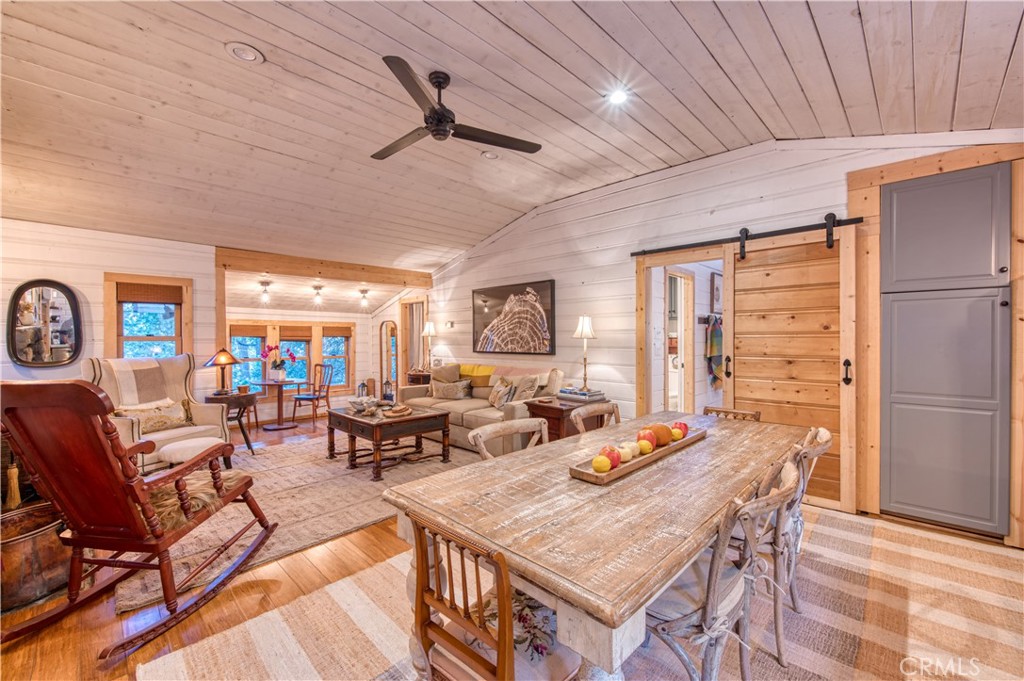 9287 Corral Road Forest Falls, CA 92339 - Photo 6 of 26 a living room with furniture a rug and a large window