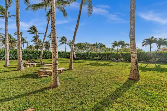 a view of a livingroom with a dinning area hardwood floor and a kitchen