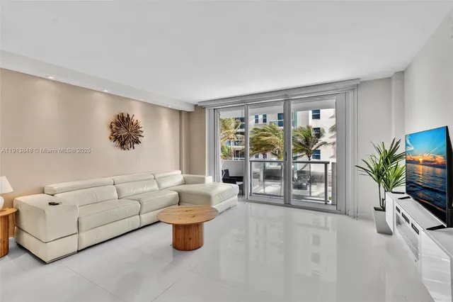 a kitchen with a refrigerator a stove top oven and a sink