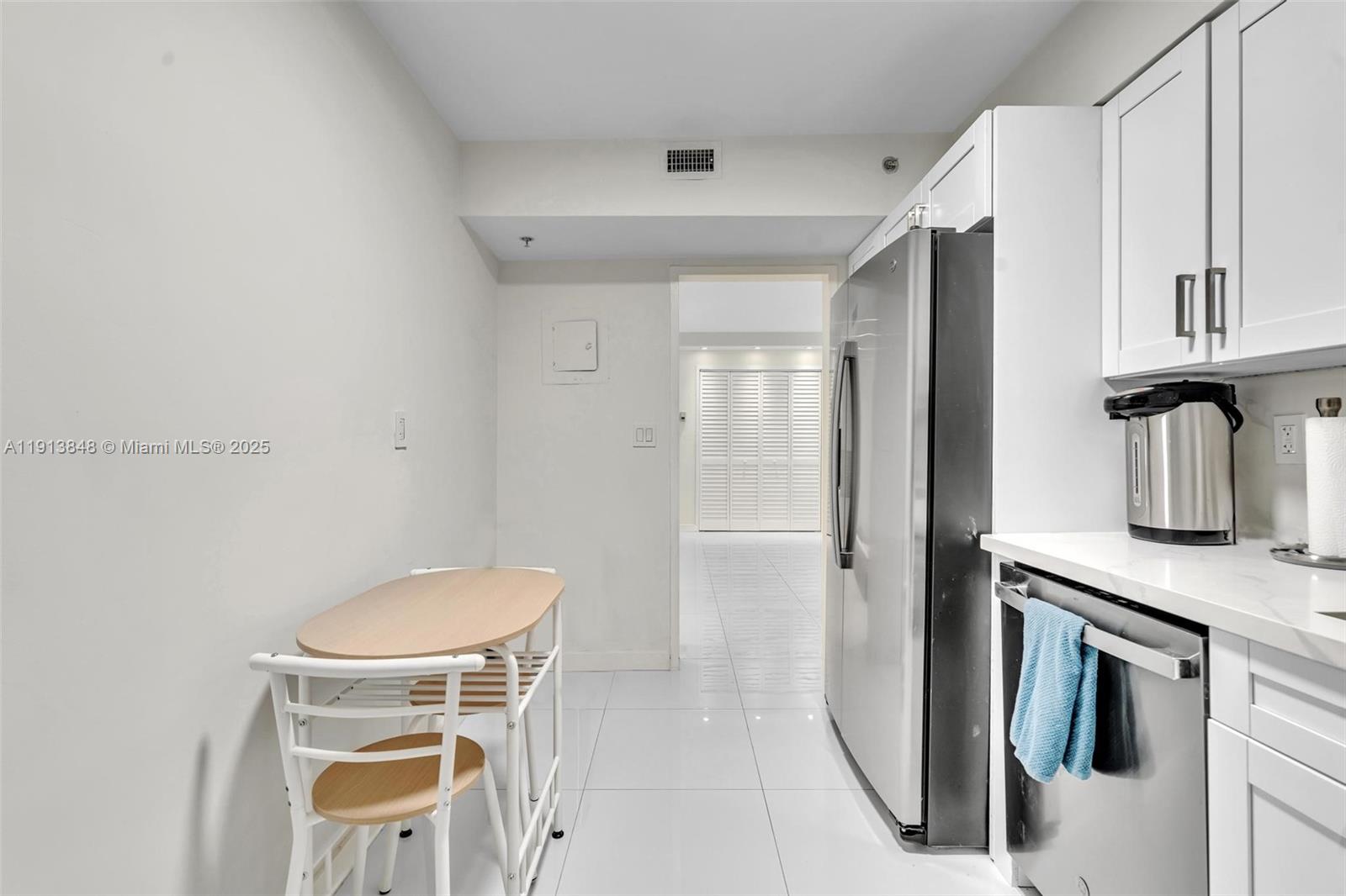 9195 Collins Avenue, Unit 303 Surfside, FL 33154 - Photo 23 of 44 a bathroom with a granite countertop sink toilet and shower