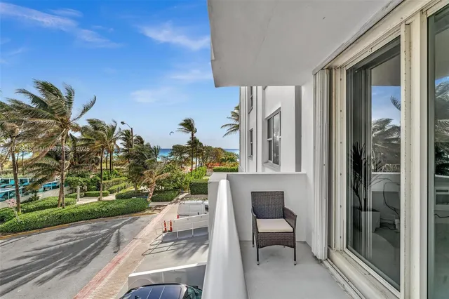 a view of balcony with furniture