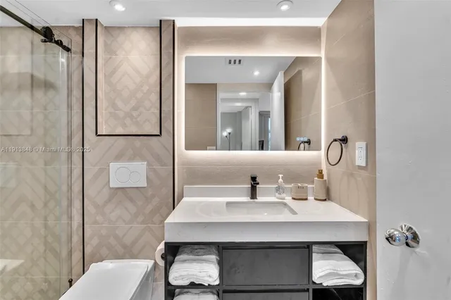 a bedroom with a bed and a night lamp