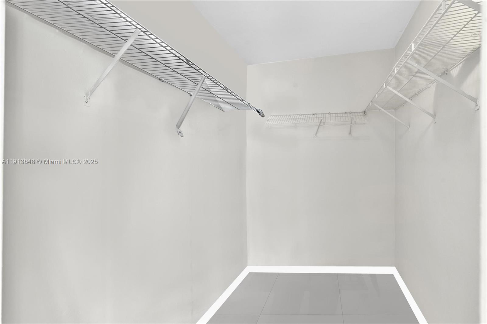 9195 Collins Avenue, Unit 303 Surfside, FL 33154 - Photo 34 of 44 a view of small space with racks on the wall