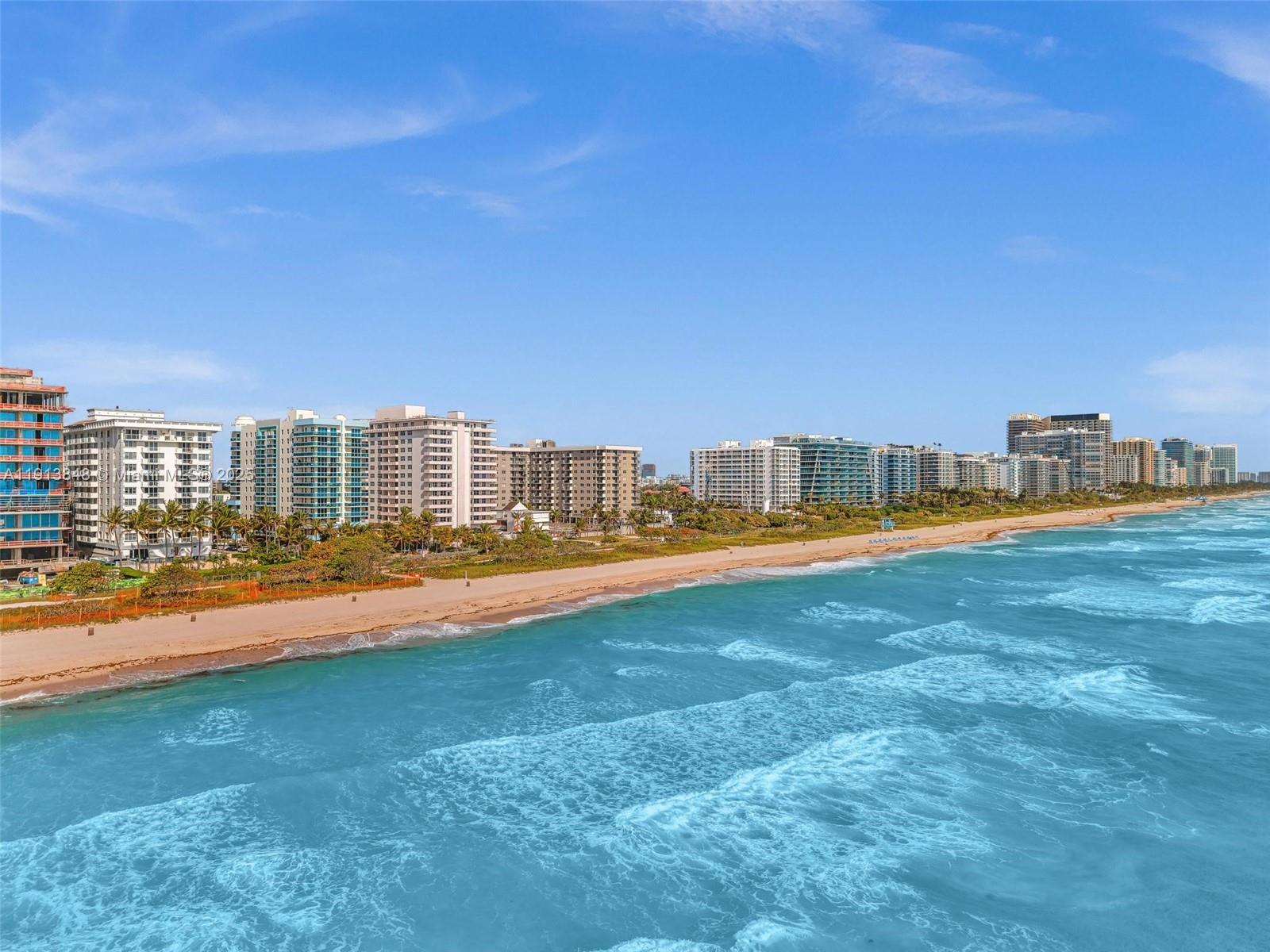 9195 Collins Avenue, Unit 303 Surfside, FL 33154 - Photo 41 of 44 a house view with swimming pool in front of the house