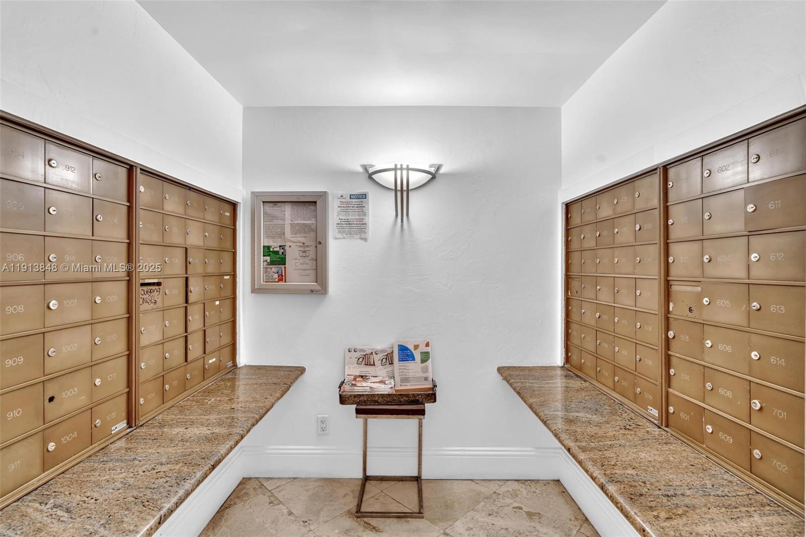 9195 Collins Avenue, Unit 303 Surfside, FL 33154 - Photo 7 of 44 a view of a bedroom with wooden floor and cabinet