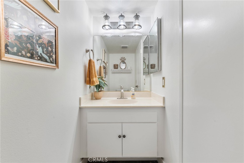 6134 Arroyo Road, Unit 3 Palm Springs, CA 92264 - Photo 20 of 35 a bathroom with a sink and a mirror