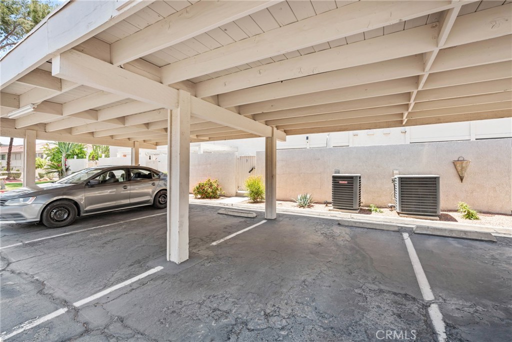6134 Arroyo Road, Unit 3 Palm Springs, CA 92264 - Photo 25 of 35 a view of garage with a car parked in it