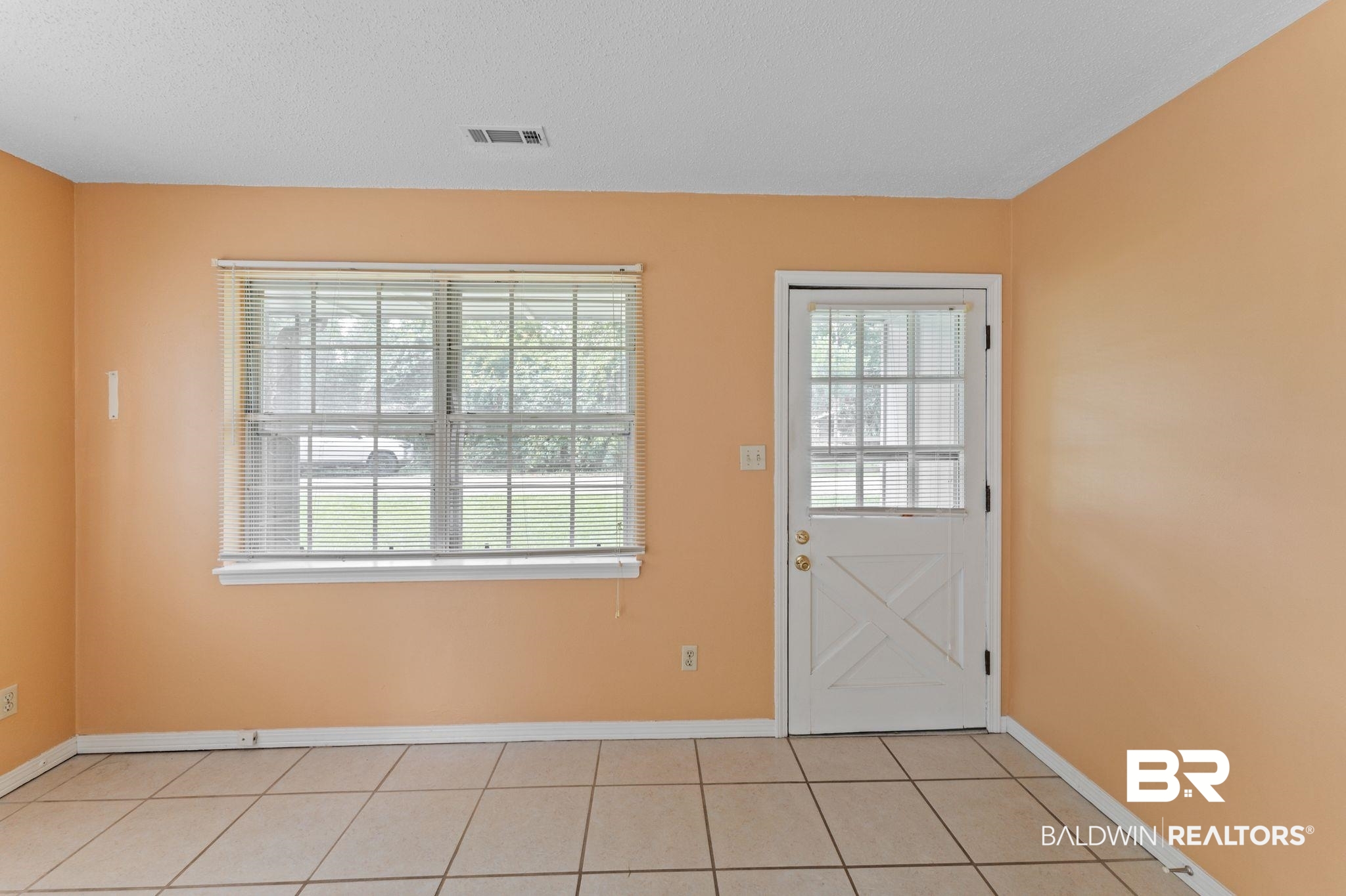 14095 Riverside Drive Foley, AL 36535 - Photo 5 of 30 Entryway with light tile patterned floors and a textured ceiling