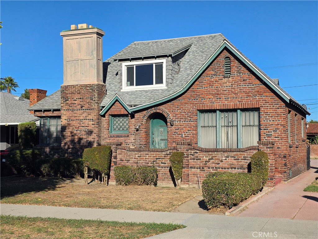 320 South Sloan Avenue Compton, CA 90221 - Photo 2 of 4 a front view of a house with a yard