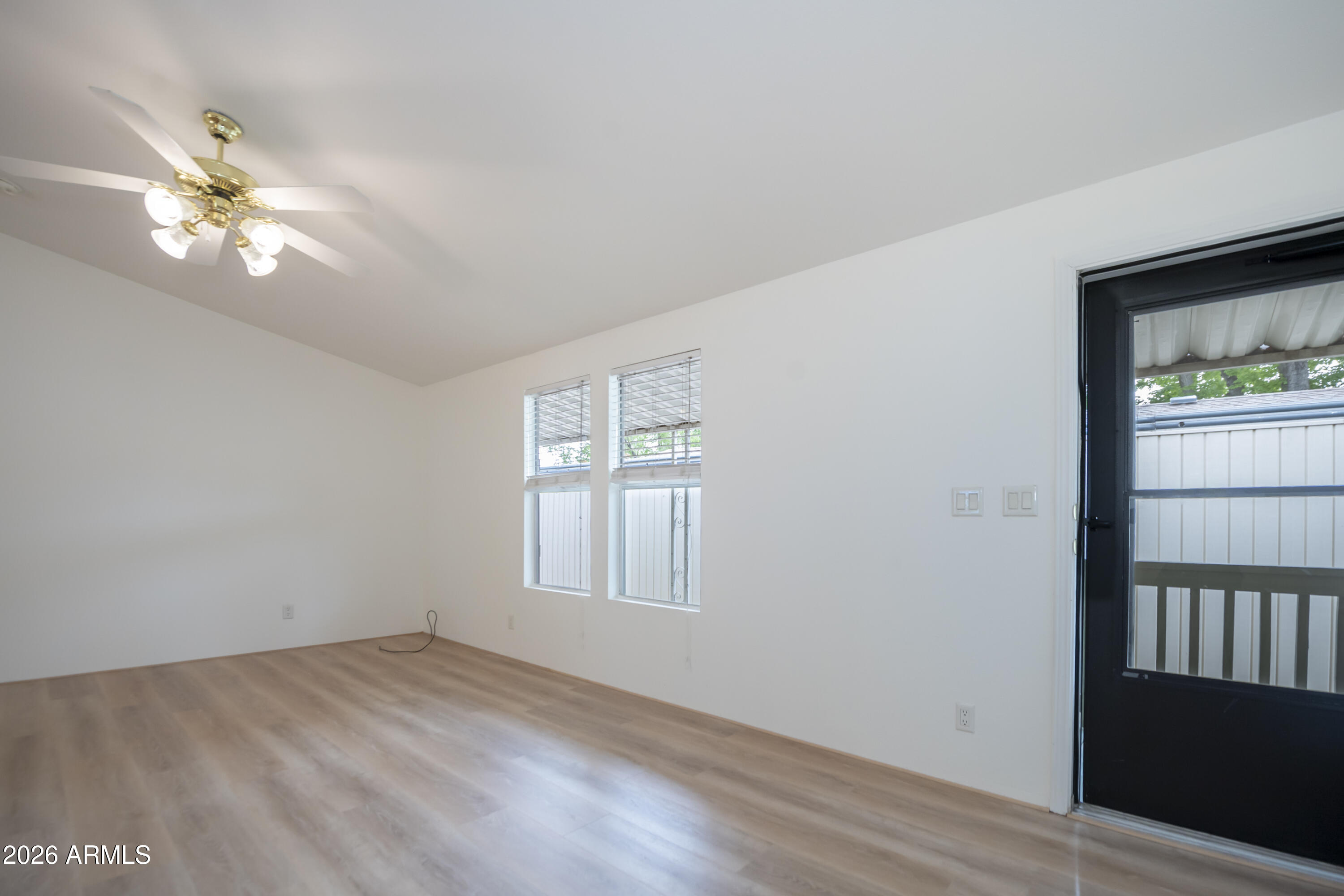 11250 East State Rte 69, Unit 1125 Dewey, AZ 86327 - Photo 6 of 45 a view of empty room with wooden floor