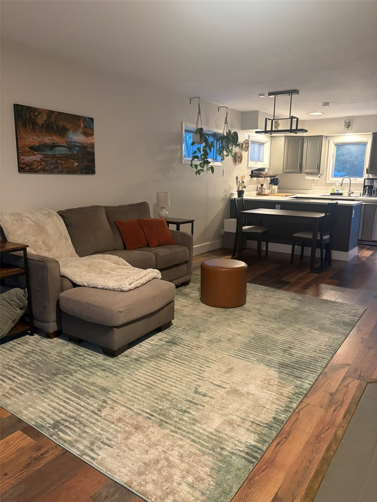 140 Atlantic Lode, Unit 9 Breckenridge, CO 80424 - Photo 1 of 7 a living room with furniture and a wooden floor