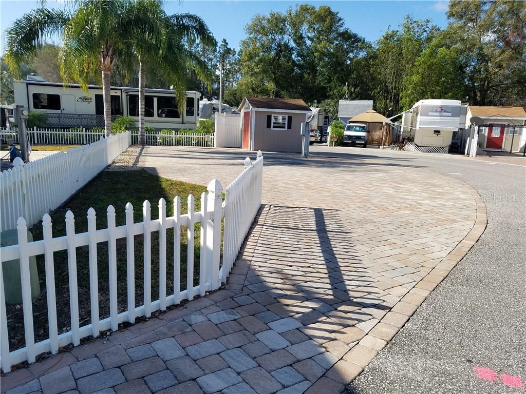 20300 Leonard Road, Unit 54 Lutz, FL 33558 - Photo 1 of 1 a outdoor view with a bench