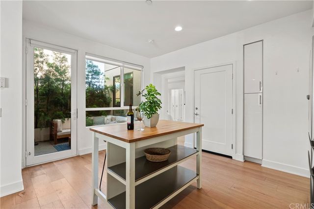 a view of a workspace with furniture and window