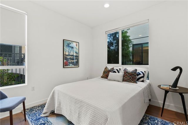 a bedroom with a bed and a mirror