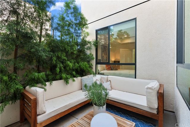 a view of a two couches in a living room