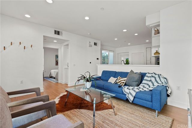 a living room with furniture and a rug