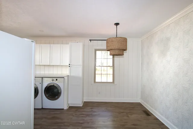 a living room with wooden floor and ceiling fan