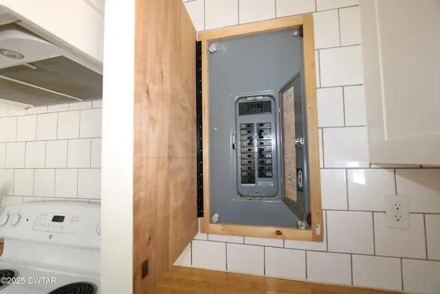 a bathroom with a bathtub and mirror