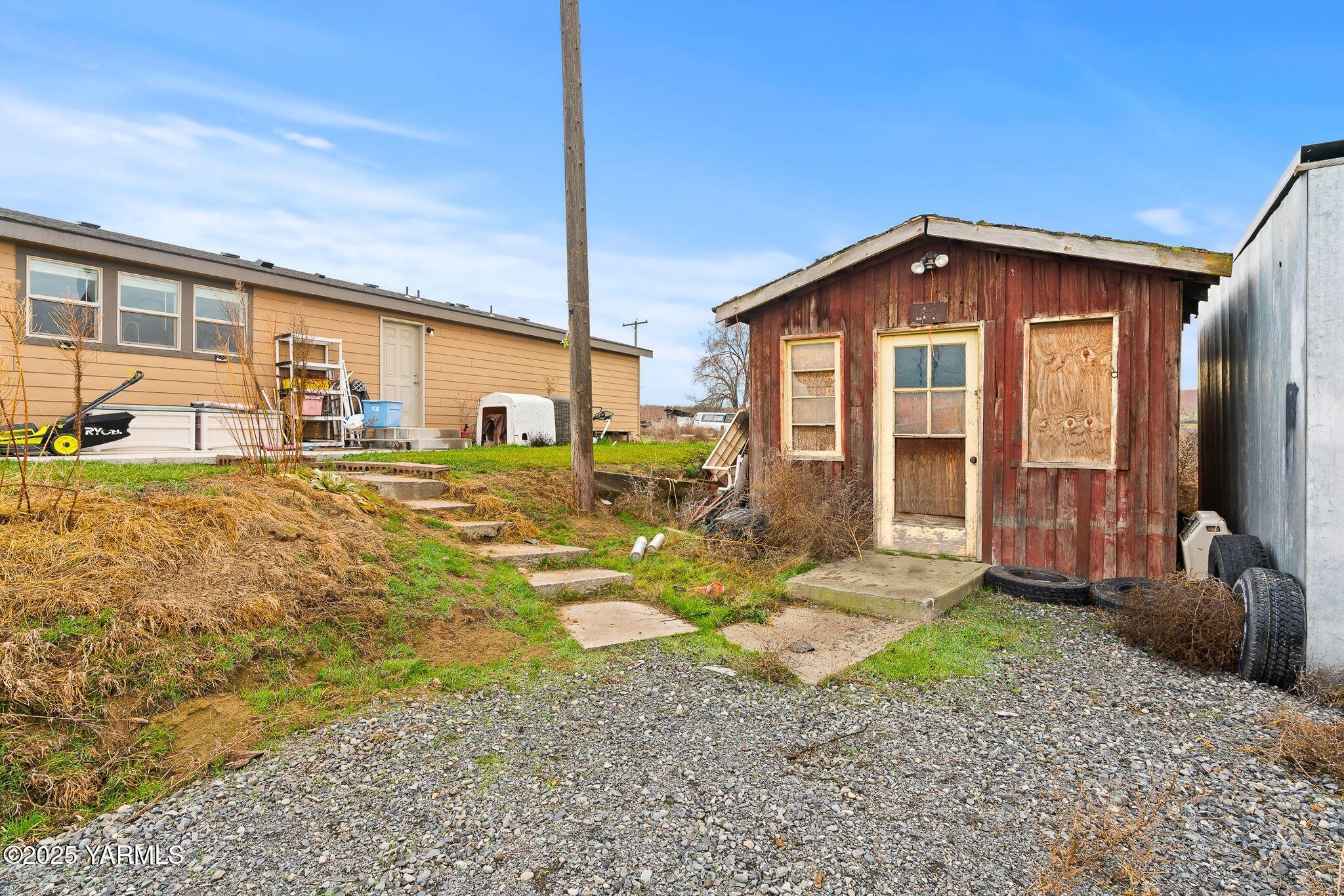 1351 Nass Road Granger, WA 98932 - Photo 34 of 38 a front view of a house with a yard