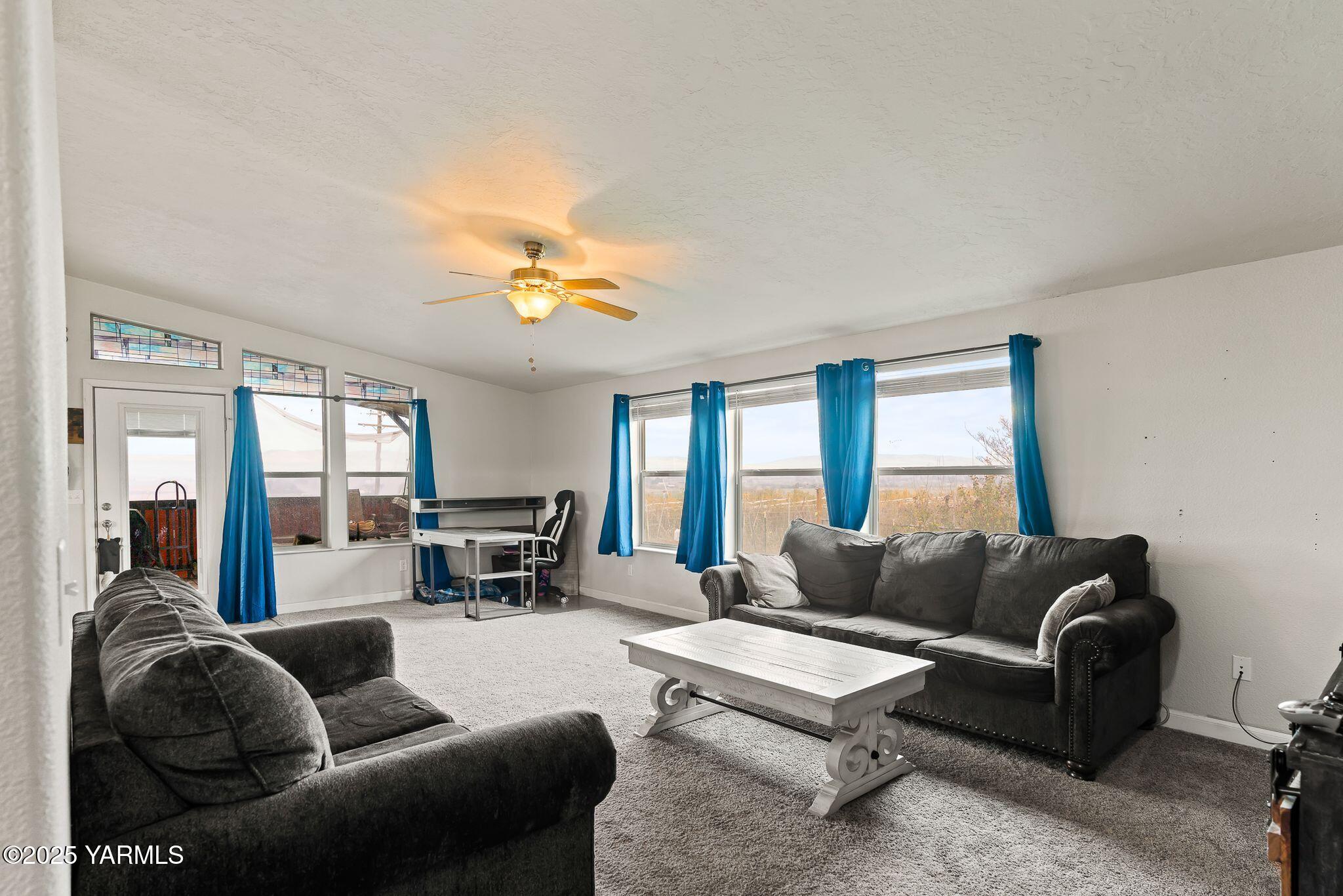 1351 Nass Road Granger, WA 98932 - Photo 10 of 38 a living room with furniture and a large window