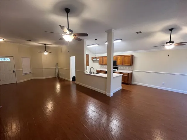 a view of a kitchen with a sink and a stove top oven