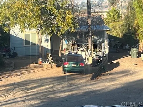 a view of street with parked cars