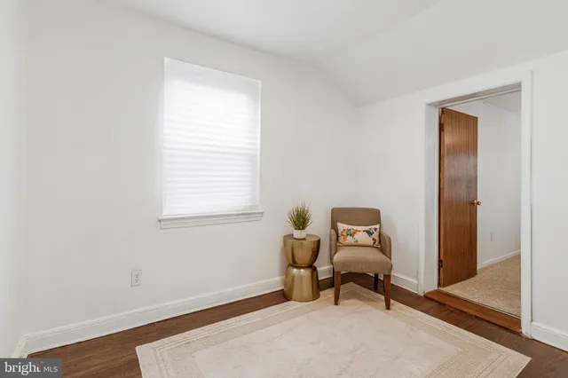 a room with a window and chair