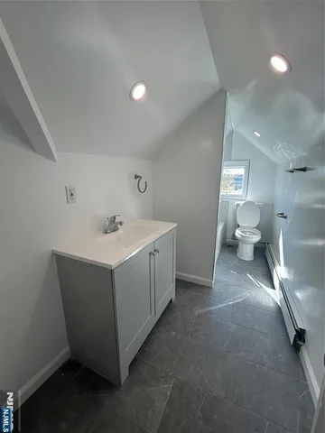 a bathroom with a sink and a large mirror
