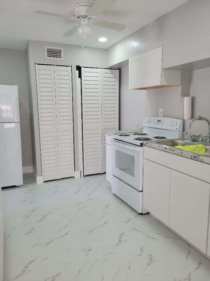 1119 West 32nd Street Riviera Beach, FL 33404 - Photo 14 of 27 1119 32ND KITCHEN AND PANTRY