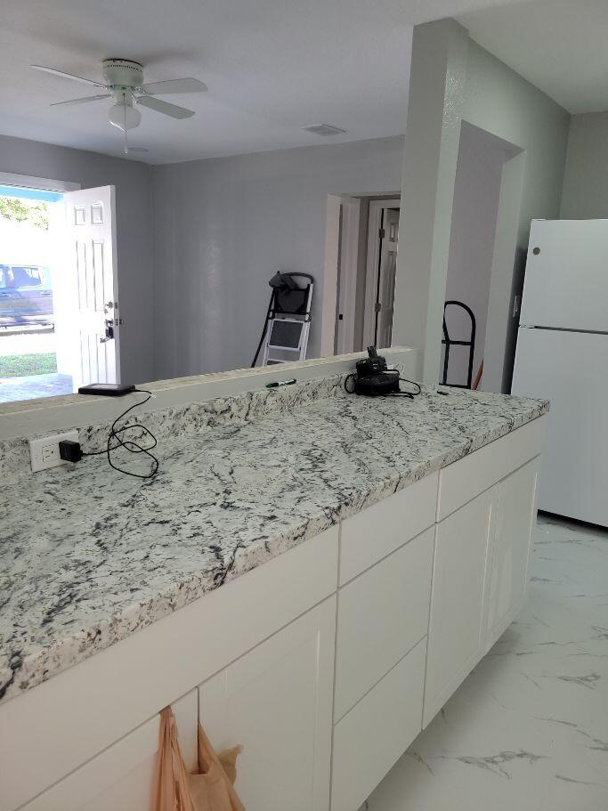 1119 West 32nd Street Riviera Beach, FL 33404 - Photo 16 of 27 1119 32ND KITCHEN COUNTER TO LIVING RM