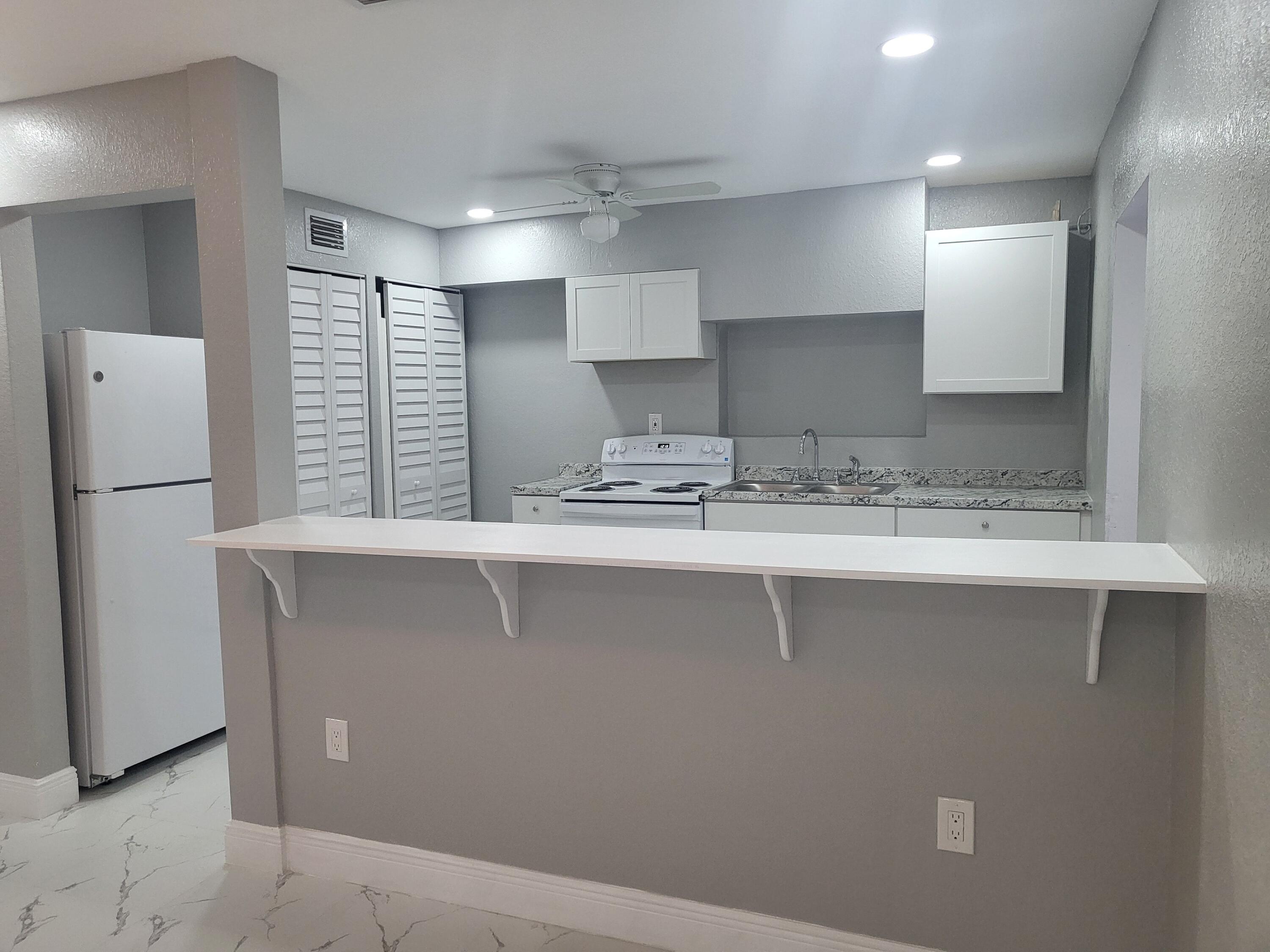 1119 West 32nd Street Riviera Beach, FL 33404 - Photo 23 of 27 1119 32nd kitchen from lv rm