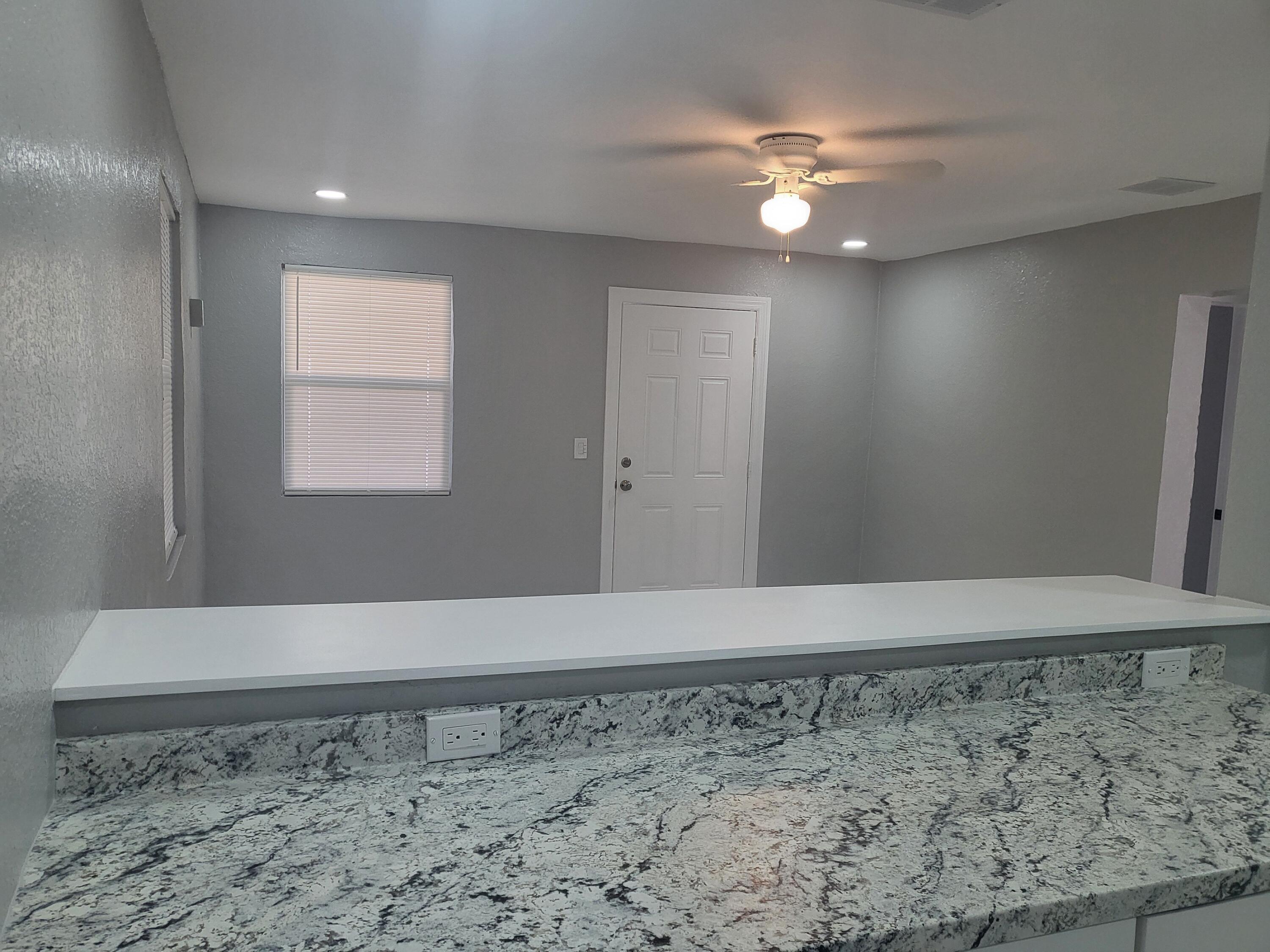 1119 West 32nd Street Riviera Beach, FL 33404 - Photo 24 of 27 1119 32nd kitchen to living room