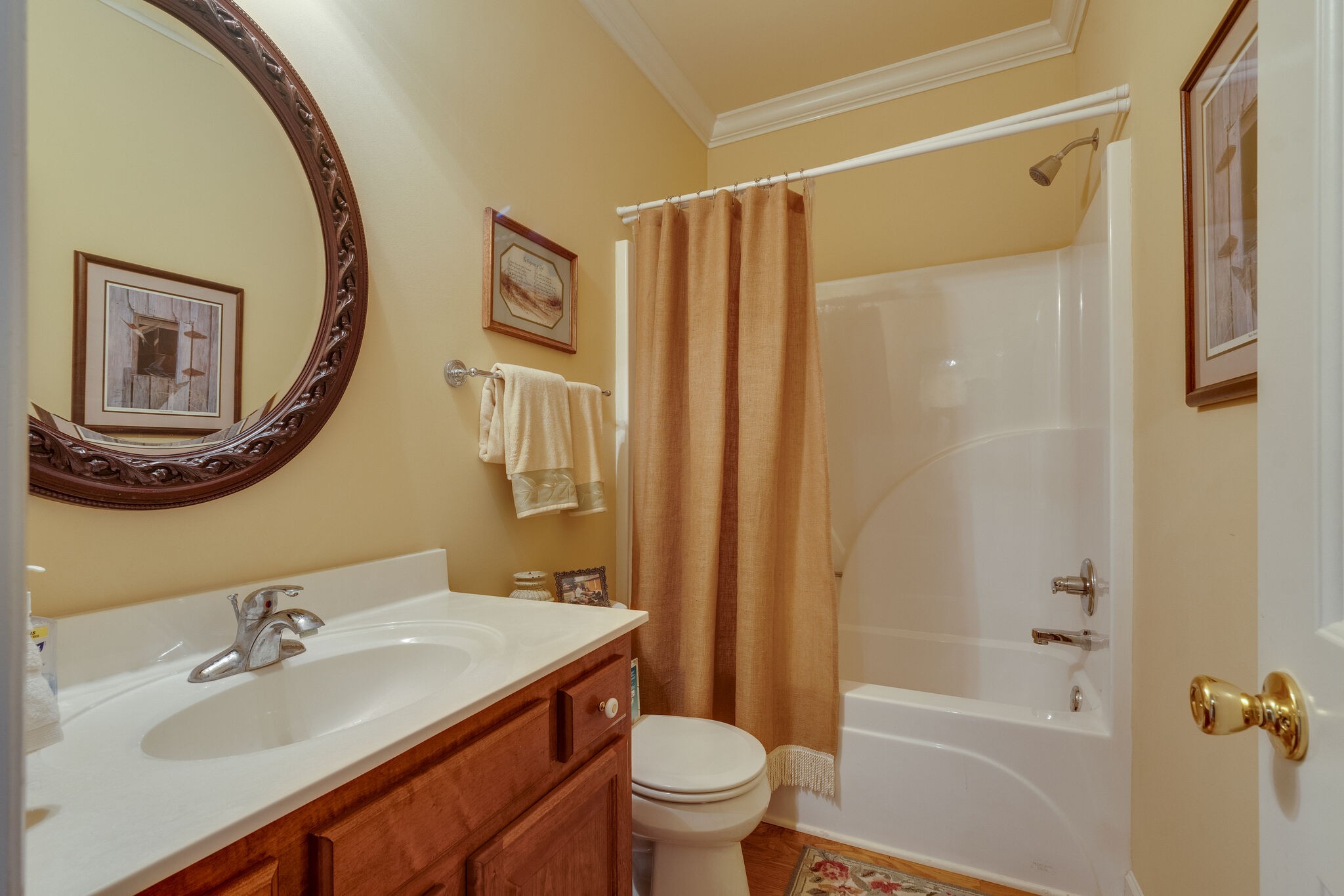 56 Stephens Creek Road Kelso, TN 37348 - Photo 24 of 47 a bathroom with a sink a mirror a toilet and a bathtub