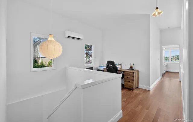 a room with a sink and a mirror