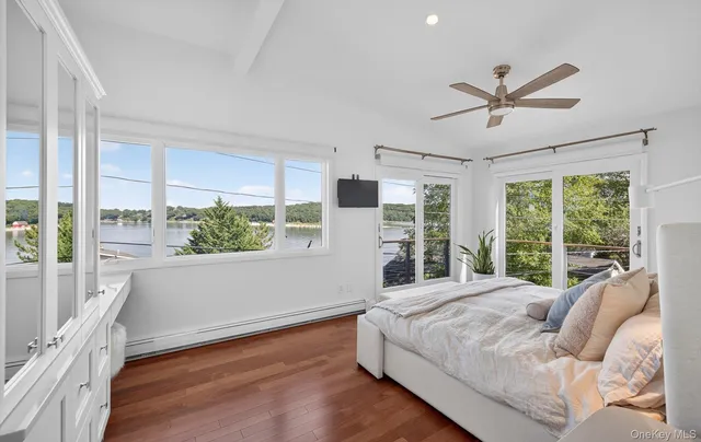 a bedroom with a large bed and a large window