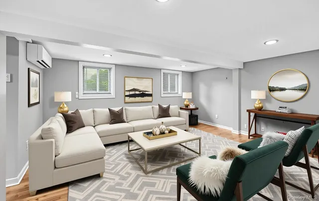 a view of patio with chairs and table under an umbrella