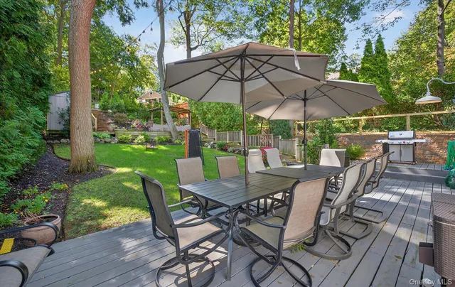 a view of a table and chairs on the roof deck